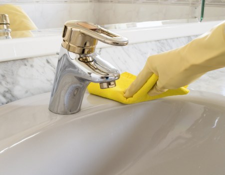 Bathroom deep cleaning in Tooting focusing on taps, tiles, and limescale removal
